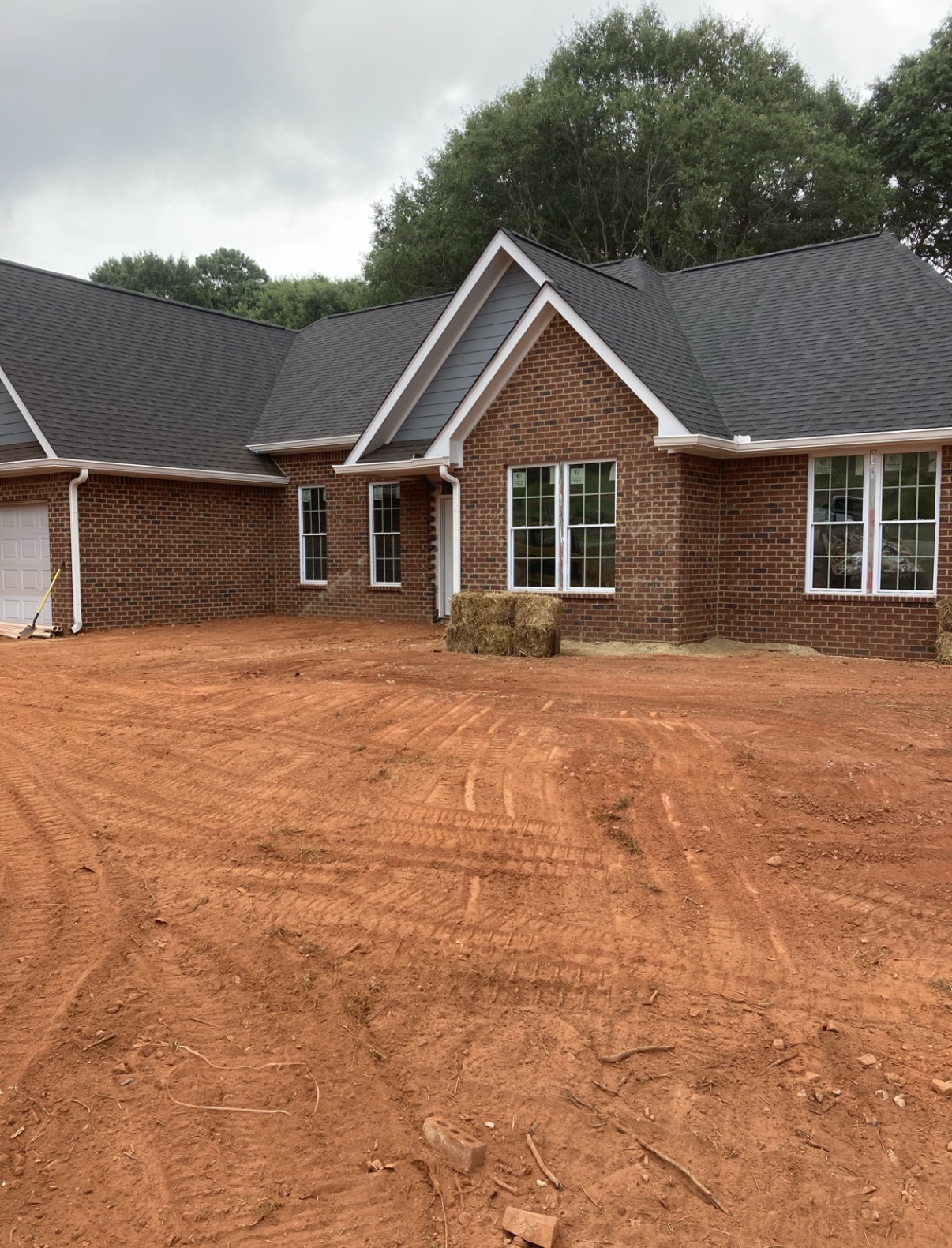 Finish grading around a house pad in Georgia
