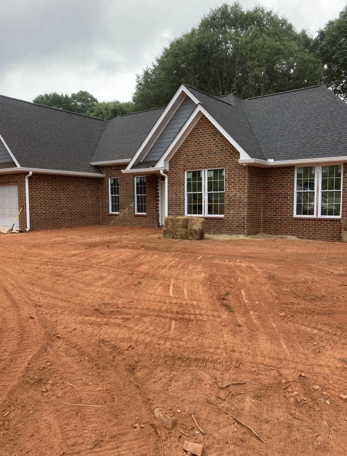 Finish grading around a house pad in Georgia